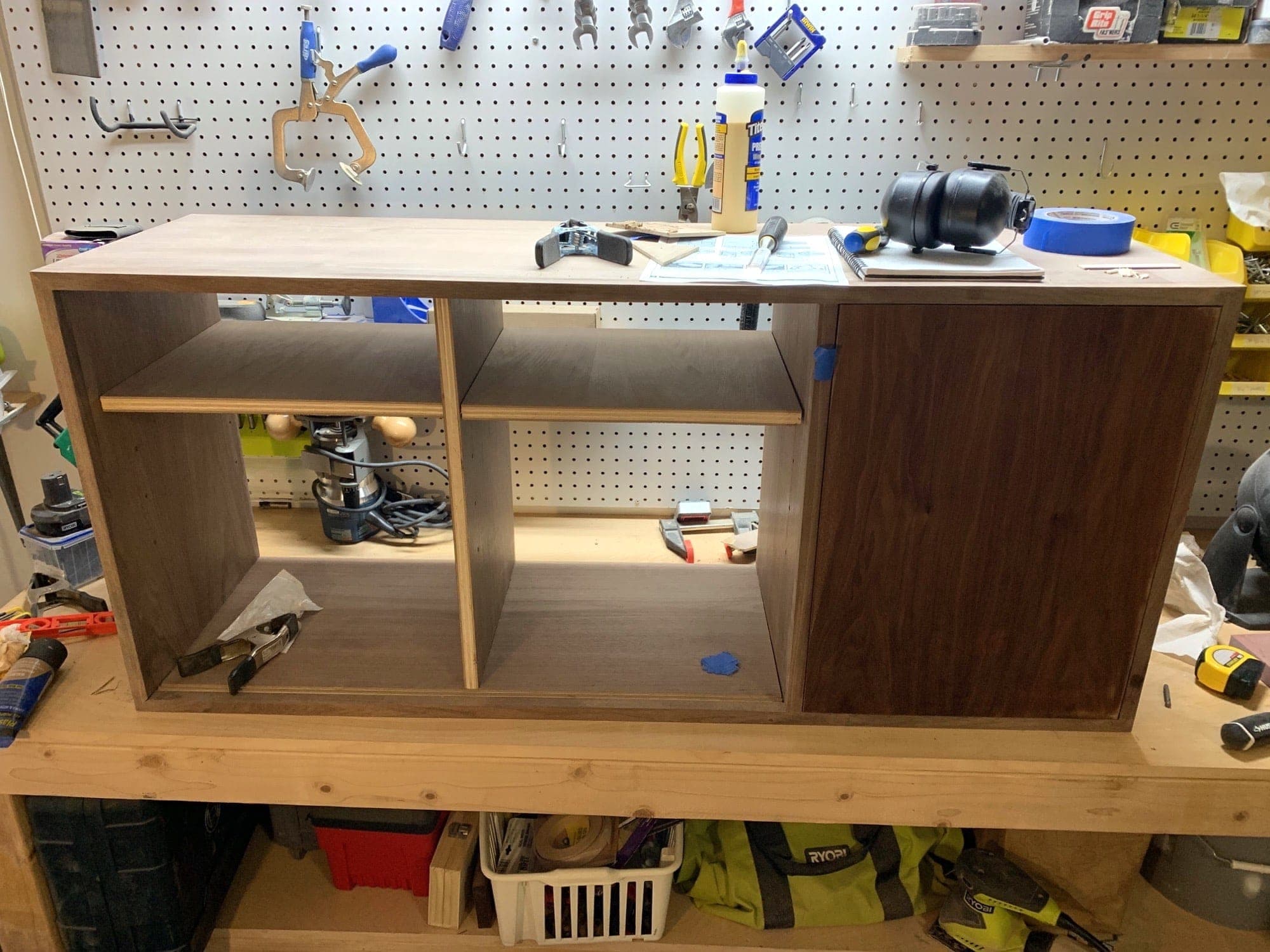 right door in place, along with a shelf in each of the two left cabinets
