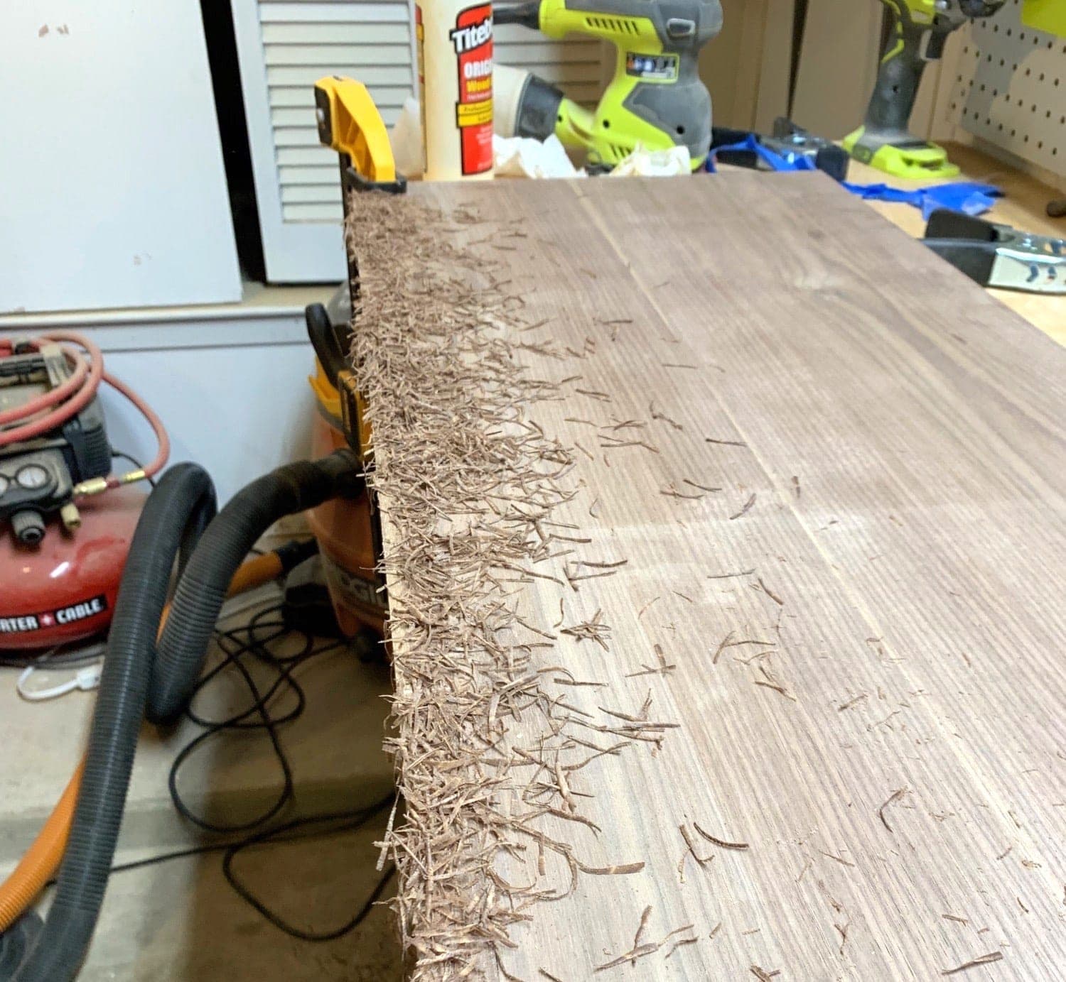 board after routing the edging flush with lots of wood shavings covering it