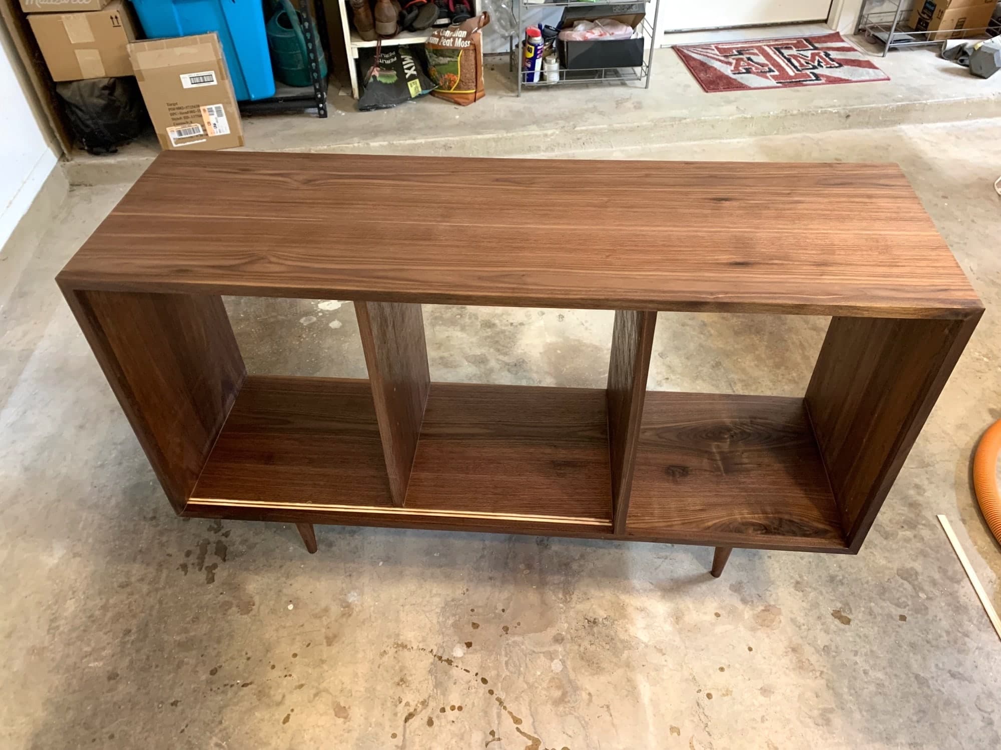 credenza with first coat of urethane, wood much richer and darker