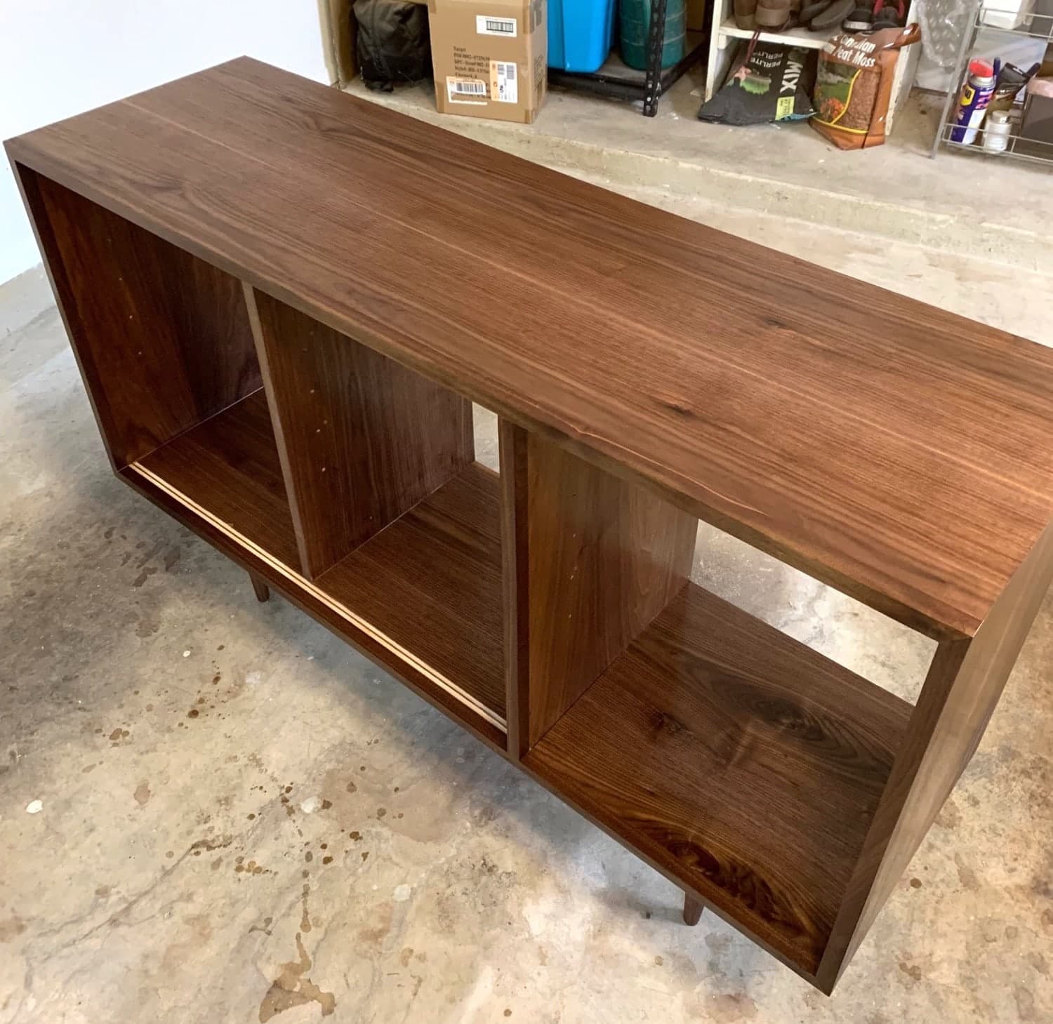 credenza with second coat of urethane applied, looks glossier and smoother