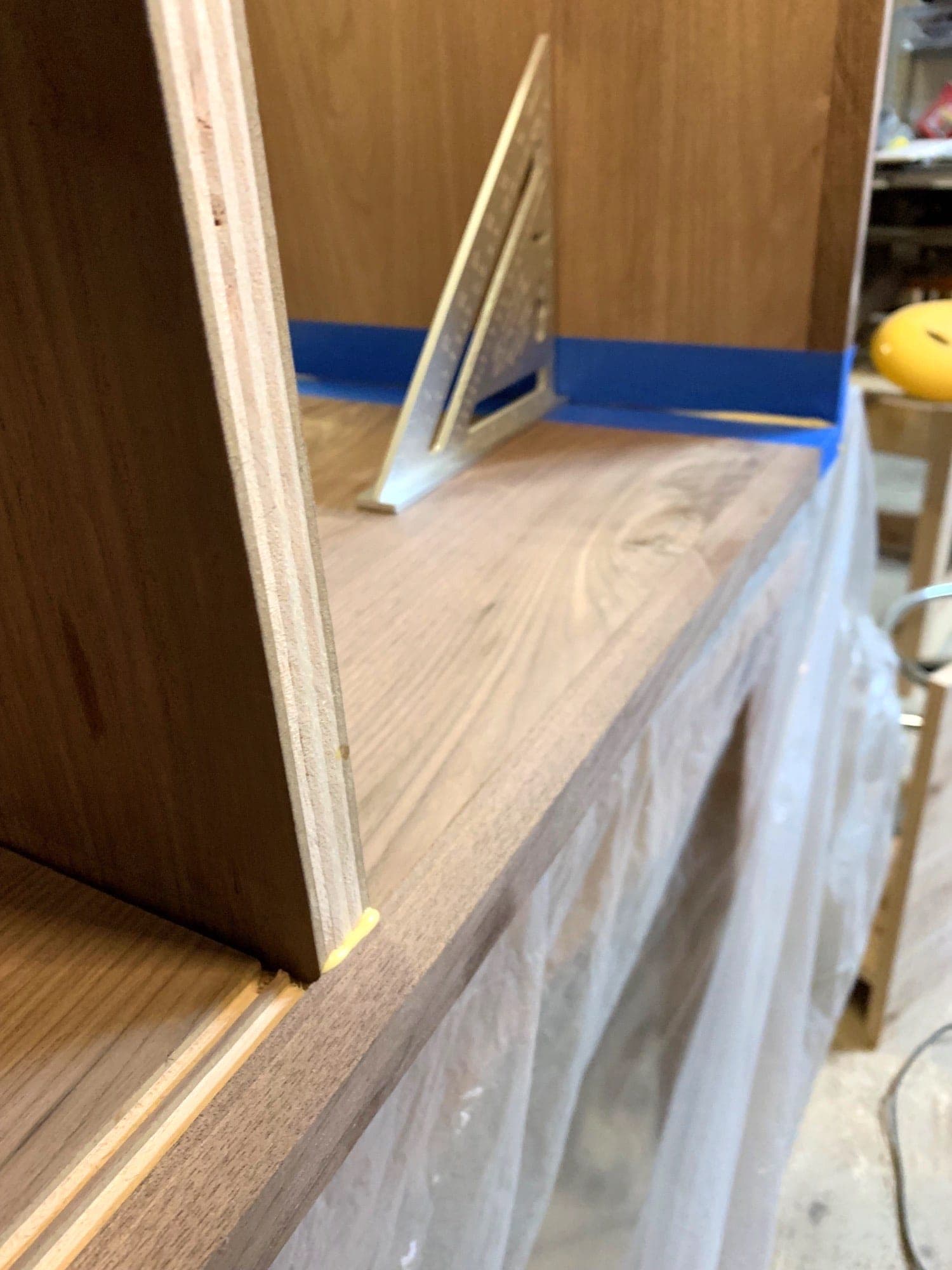 the dividers in place with glue seeping out between dividers and bottom