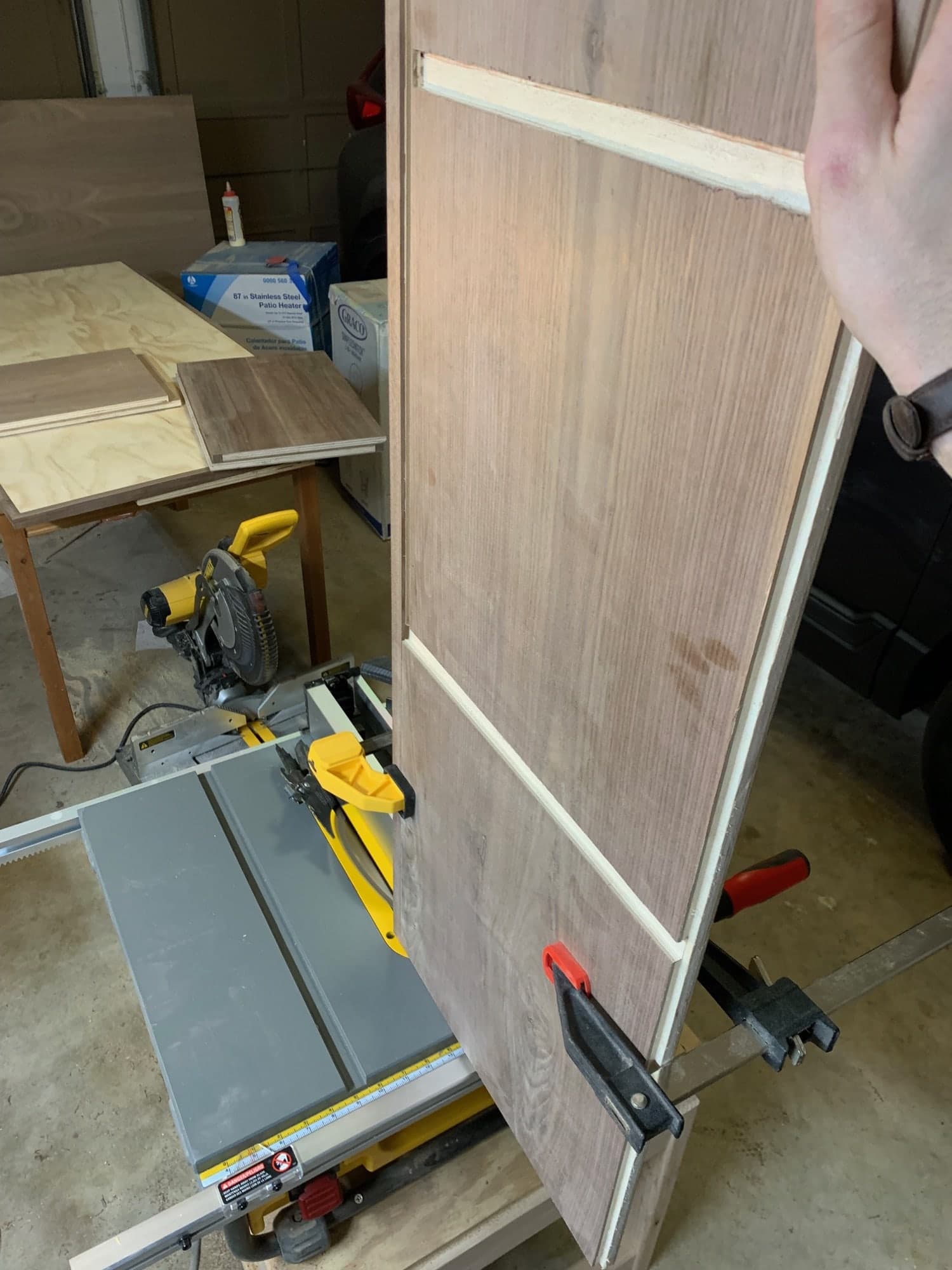using the jig to cut the bottom piece on the table saw