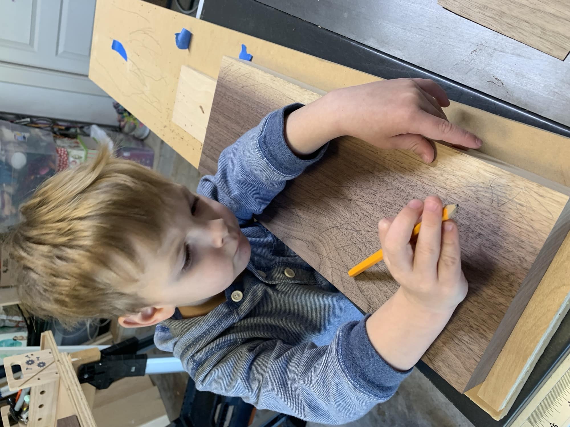picture of my son, Sammy, scribbling on a board with pencil
