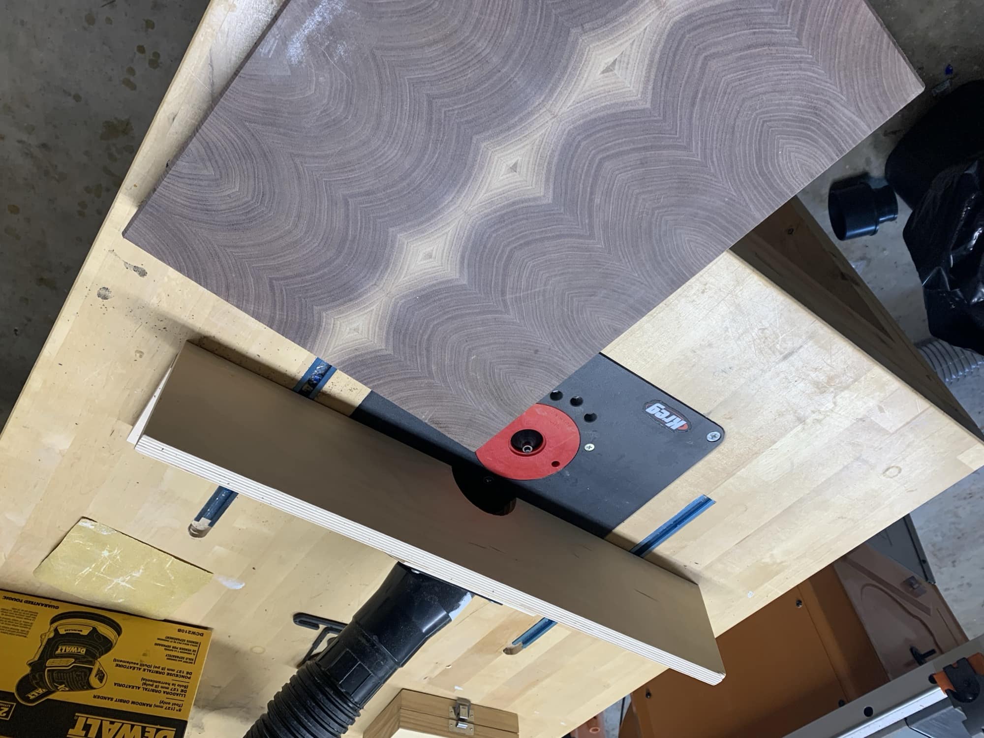 Router table set up with board ready to be run through